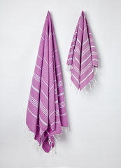 Hanging large and small Sorbet Hammam Towels in Blueberry purple