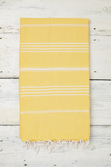 bright yellow hammam towel with tassels