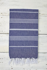 blue and white hammam towel with tassels