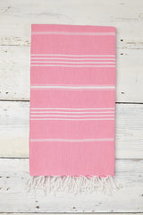 pink and white turkish hammam towel with tassels